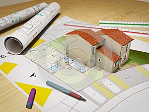 House under construction on top of blueprints