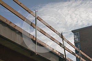 House under renovation with railing for construction site on the facade