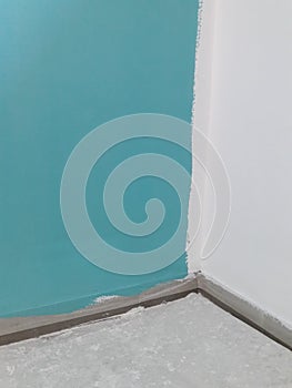 House under renovation: turquise wall wet paint