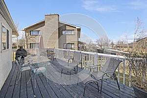 House veranda with covered griller, armchairs and table sets