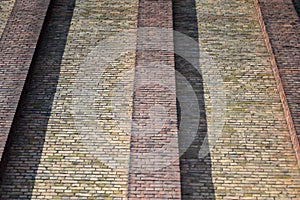 House wall made of different colored bricks