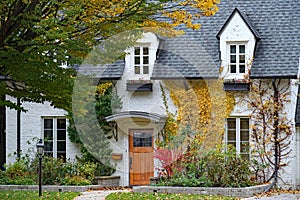 house with white painted bricks and dormer window