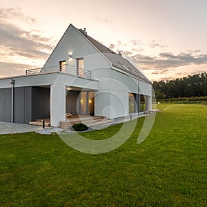 House with wide green lawn