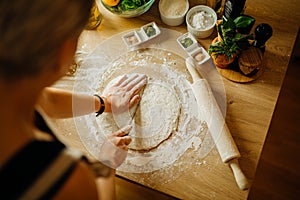 House wife making quick easy homemade crunchy crust dough from scratch by hand. Gluten free.Gluten intolerance.Low carb substitute