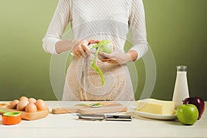 House wife wearing apron making. Steps of making cooking apple c