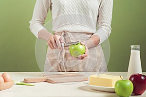 House wife wearing apron making. Steps of making cooking apple c