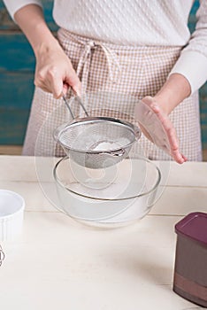 House wife wearing apron making. Steps of making cooking chocolate cake.