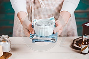 House wife wearing apron making. Steps of making cooking chocolate cake.