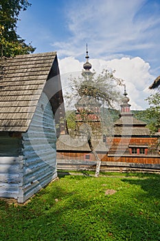 House and wooden church  in open air museum near Bardejovske kupele spa resort during summer