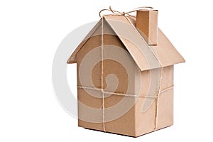 House wrapped in brown paper cut out