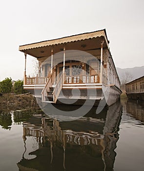 Houseboat in a lake, Dal Lake, Srinagar, Jammu And Kashmir, India photo