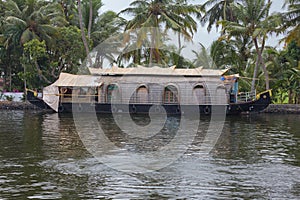 Houseboat moored on the bank of a canal