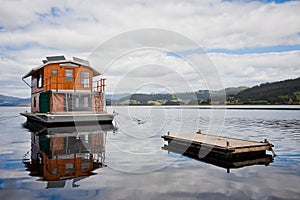 Houseboat on river photo