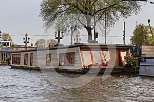 Houseboat at the sunset in Amsterdam