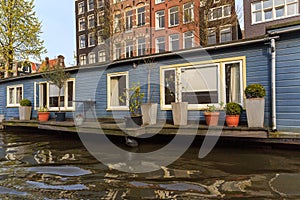Houseboat with terace in Amsterdam photo
