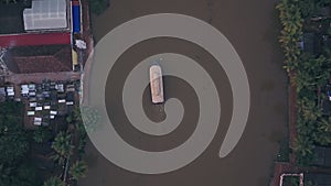 Houseboat tour of Kerala backwaters at Alleppey, India. Aerial top down drone vi