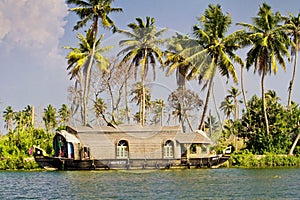 Houseboats on the backwaters of Kerala in Alappuzha Alleppey in India. A traditional tourist attraction is the house-boat on the