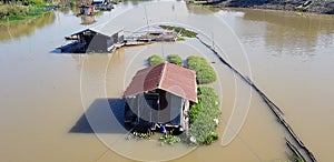 Houseboats and floating plant farming fields in countryside river, Uthai Thani,Thailand.