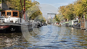 Houseboats lining a canal in Amsterdam, The Netherlands