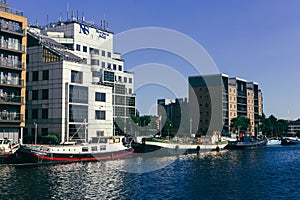 Houseboats moored in the Millwall Dock, London photo
