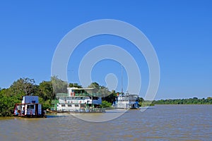 Houseboats on the riverbank at the harbor of Porto Jofre, Pantanal, Mato Grosso Do Sul, Brazil