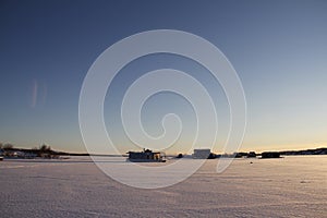 Houseboats on Yellowknife Bay in Great Slave Lake at sunset