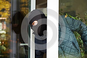 Housebreaker wearing a mask photo