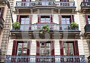 Housefront with windows and balcony.Barcelona. photo