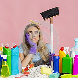 Household chores. Thoughtful girl holding a mop