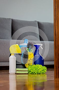 Household cleaning products and rags with reflection in the floor. Chemical liquids for cleaning. Maintaining