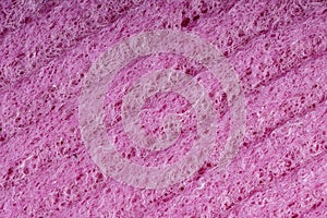 Household cleaning sponges closeup. Sponge detail texture, sponge texture close up background. Cellulose red sponge texture. Pink