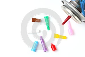 Household gas mini cylinder and nozzles or injectors for it, close-up, white background
