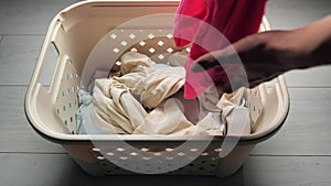 Household, housework and cleaning concept - hands of woman making bed linen