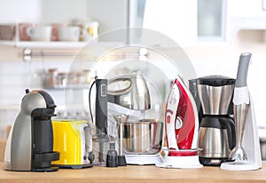 Household and kitchen appliances on table indoors