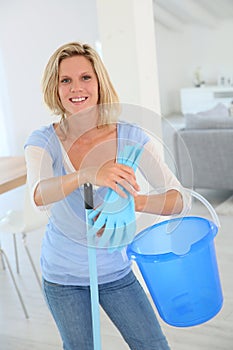 Housekeeper cleaning home photo
