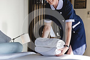 Housekeeper cleaning a hotel room