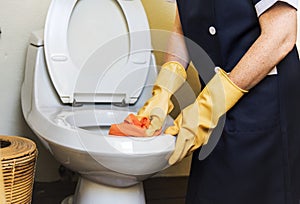 Housekeeper cleaning a hotel room