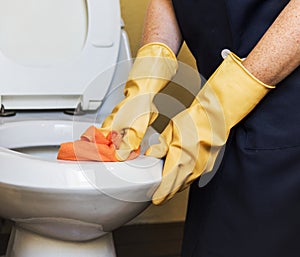 Housekeeper cleaning a hotel room