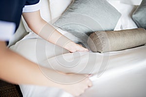 Housekeeper cleaning a hotel room photo