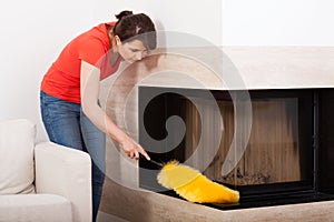 Housekeeper during dusting photo