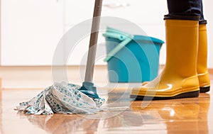 Housekeeper mopping tiled floor