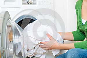 Housekeeper with washing machine photo