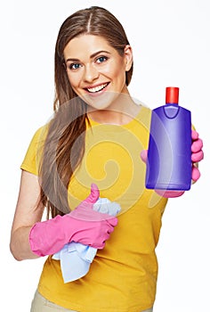 Housekeeper woman holding bottle with cleaner liquid and show t