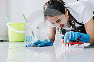 Housekeeping and cleaning concept, Happy young woman in blue rub