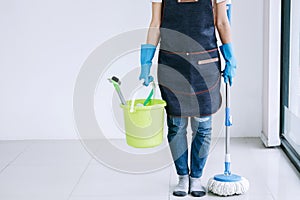 Housekeeping and cleaning concept, Happy young woman in blue rub