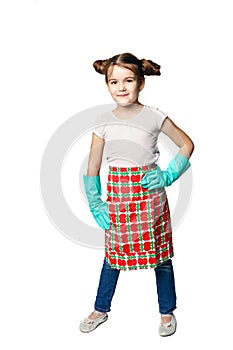 Housekeeping duties. Little girl in green rubber gloves ready for cleaning. Mom`s assistant