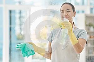 Housekeeping, products and happy woman cleaning the windows with detergent, cloth and gloves. Maid, cleaner or domestic