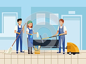 Housekeeping teamworkers with equipment tools