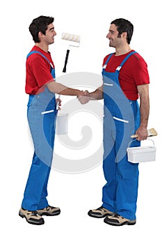 Housepainters handshaking