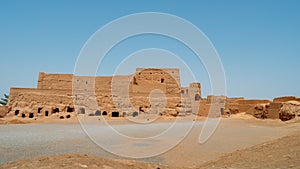 Houses of abandoned mud brick village of Kharanaq in Iran.